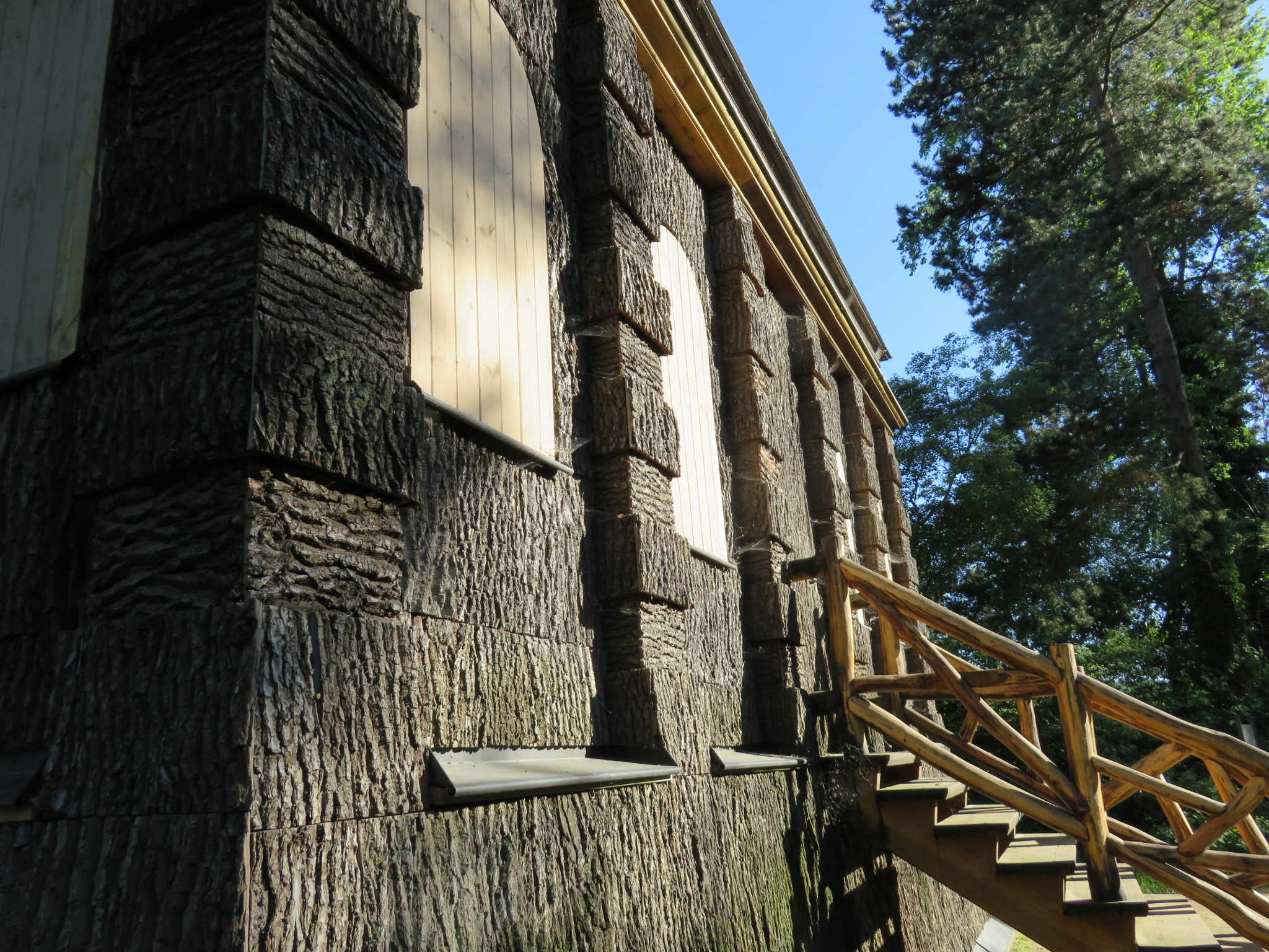 This large hunting blind at the island's southeastern shore features the curious juxtaposition of regal columns made from rustic treebark. The structure's lower floor has narrow slats that face the water, through which rifles could be fired.